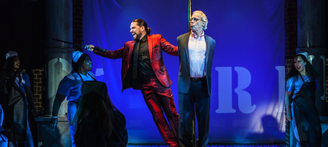 L-R: Will Swenson, Terrence Mann in “Jerry Springer – The Opera,” a production from The New Group, in a limited Off-Broadway engagement at The Pershing Square Signature Center Jan 23 – Mar 11, 2018. PHOTO CREDIT: Monique Carboni / www.thenewgroup.org